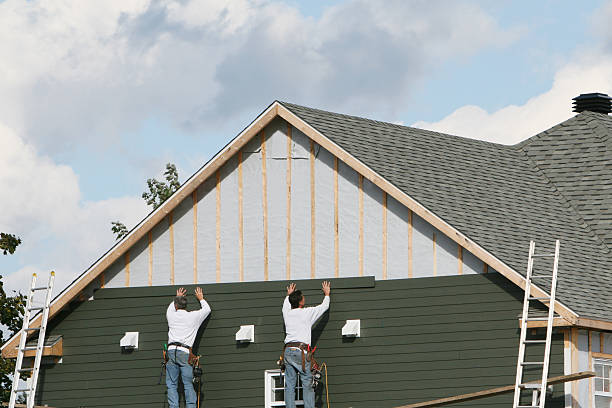 Professional Storm Damage Siding Repair technician working in Hebron, IL